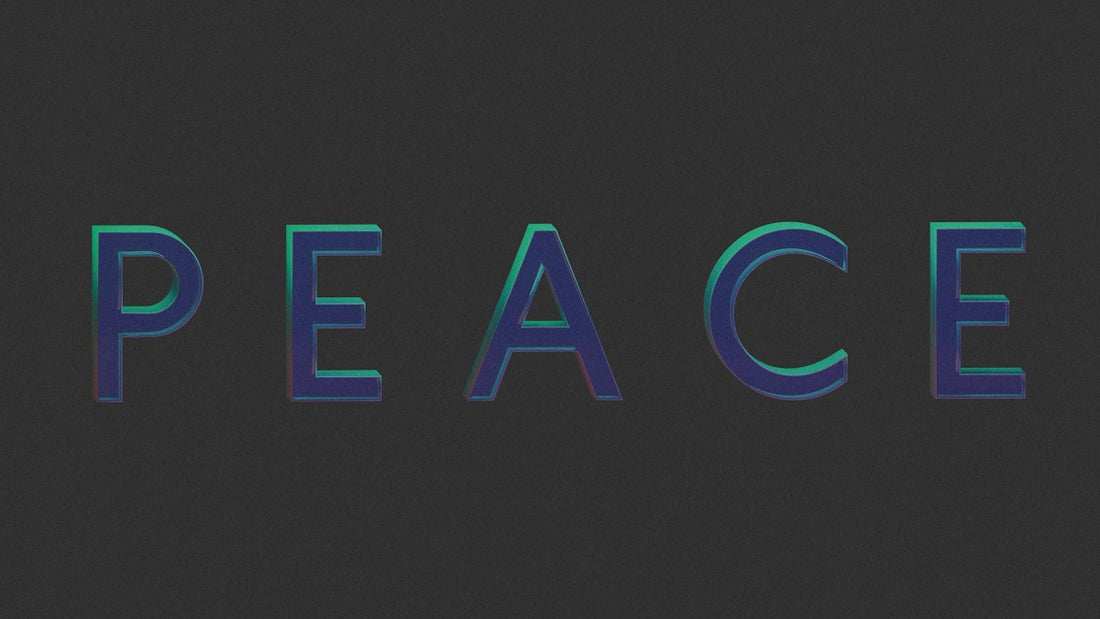 The word peace in glowing blue and green letters.