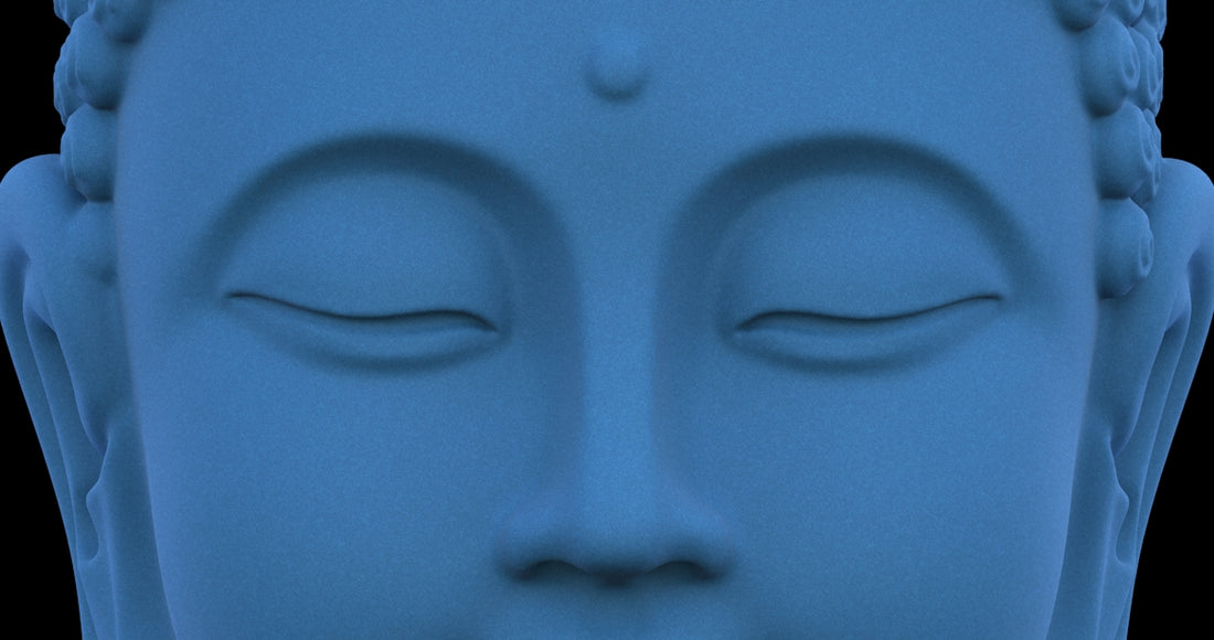 Close up of a serene blue buddha statue